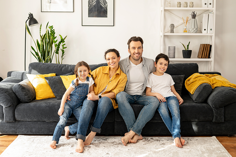 Family Garmony. Happy Multiracial Family Of Four Sitting On The Emerald Dental - Our-Practice