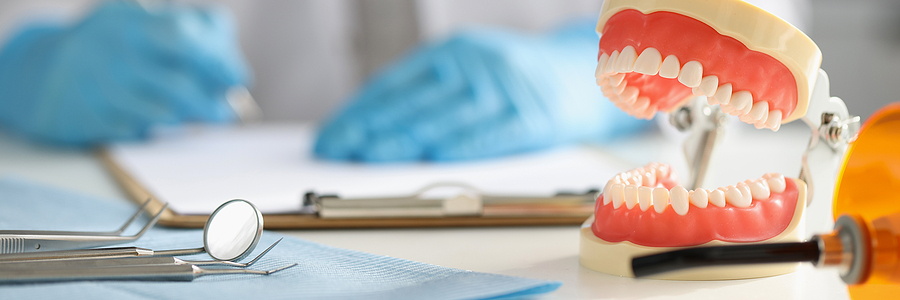 Dentist Fills Out Patient Medical Examination Card In Dental Cli Dental Insurance